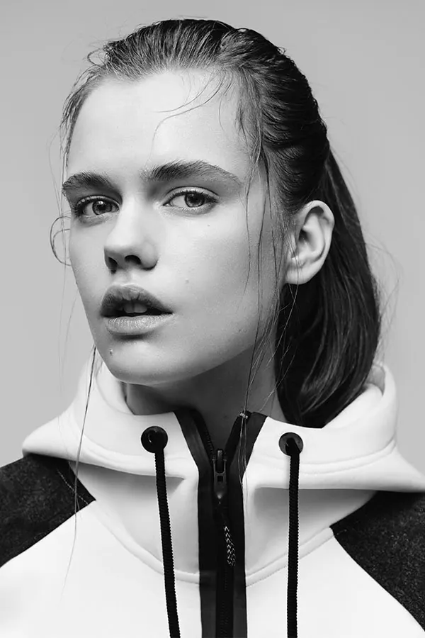 Monochrome editorial portrait with hood drawstrings, photographic, minimalist, monochrome