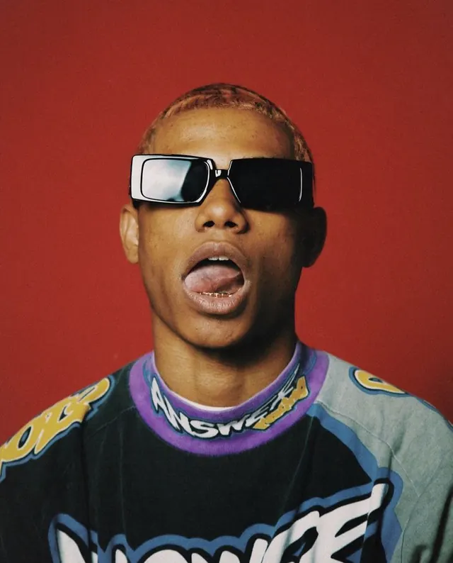 Glossy sunglasses portrait against red background, photographic, playful, warm
