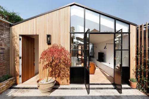 Minimal garden studio with wood and steel facade, minimal, technical, warm