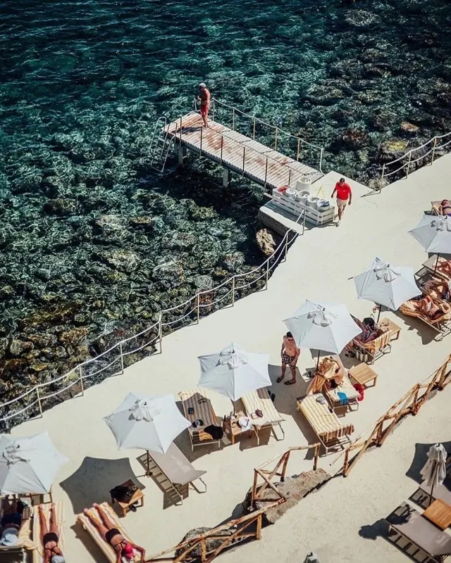 Overhead beach resort scene with turquoise water, photographic, luxury, vibrant