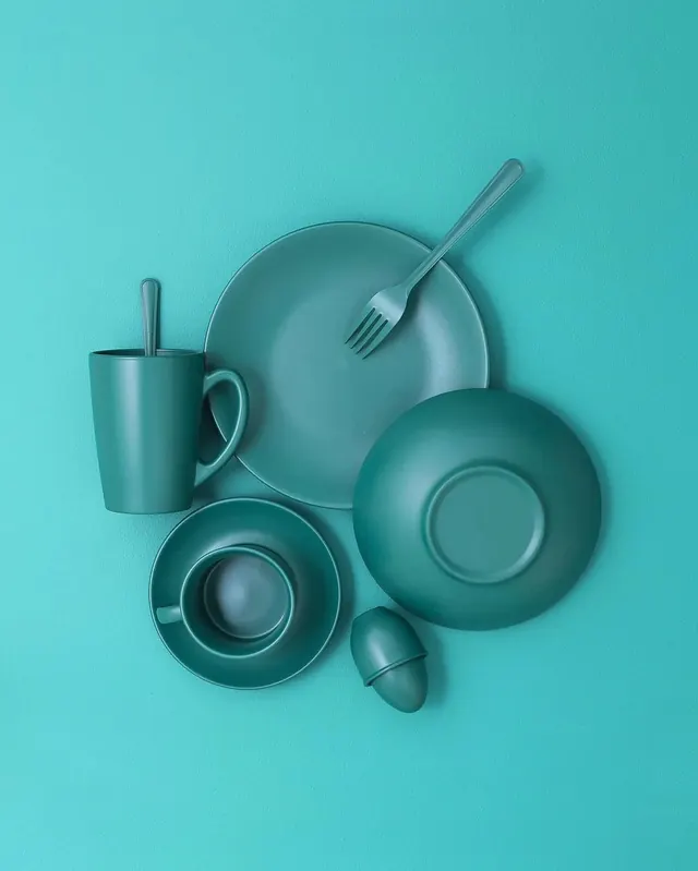 Monochromatic tableware flat lay in teal, minimalist, photographic, monochromatic