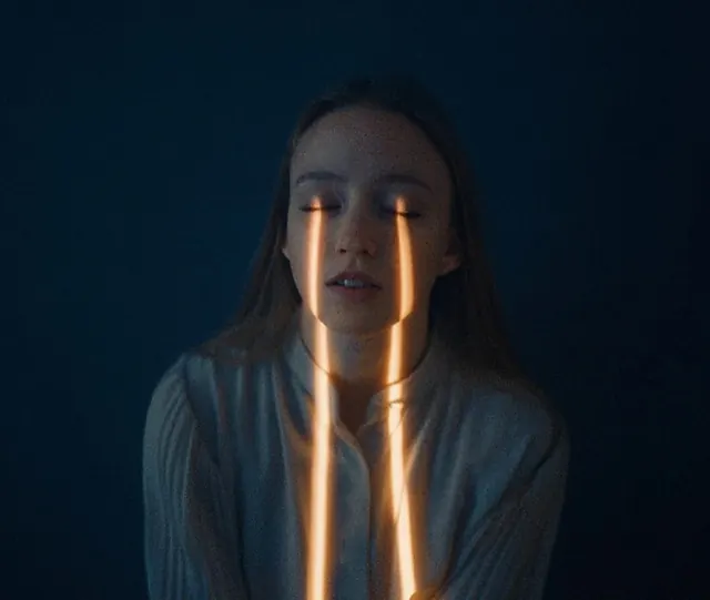 Portrait with neon orange line lighting, photographic, technical, dark