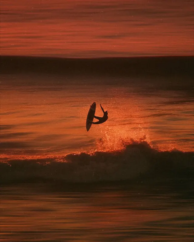 Kitesurfer silhouette golden sunset, photographic, organic, warm