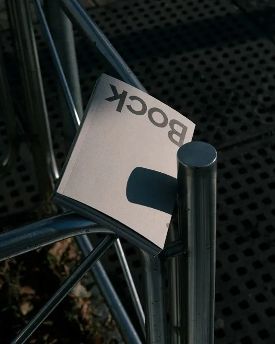 Minimalist label on bicycle frame detail, photographic, minimalist, dark