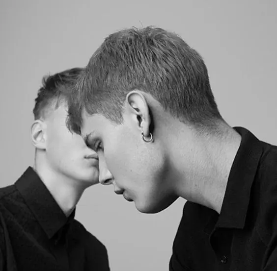 Intimate portrait two faces close together, photographic, minimalist, monochrome