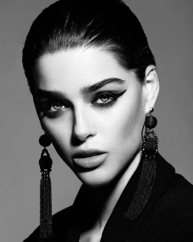 Black and white portrait with tassel earrings, photographic, technical, monochrome