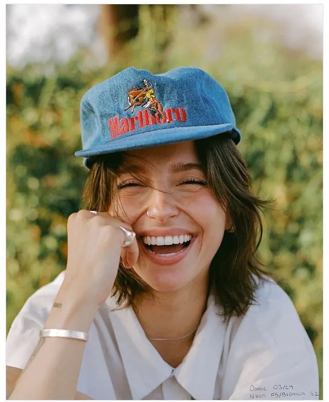 Vintage Marlboro cap portrait, photographic, playful, warm