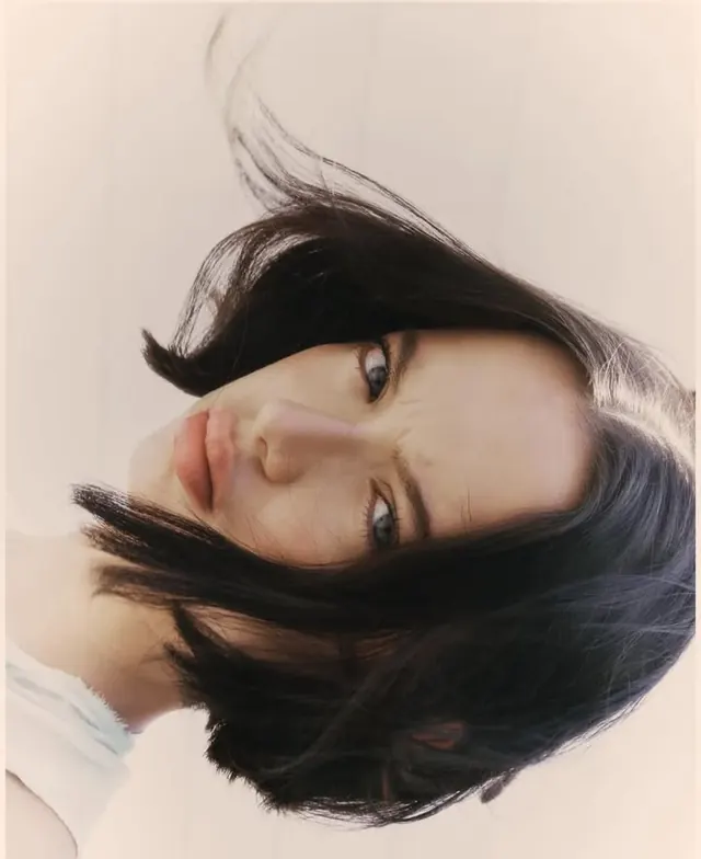 Rotated portrait with flowing dark hair, photographic, portrait, light