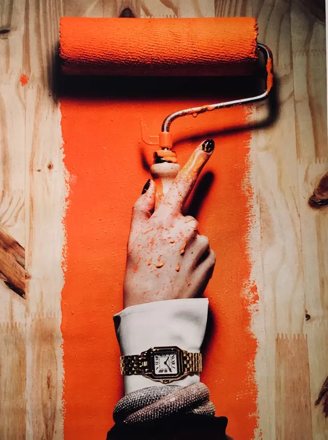 Paint roller orange wall styling photograph, photographic, minimalist, warm