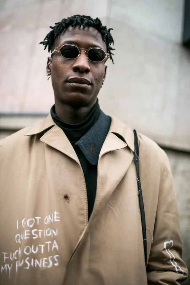 Street style portrait with graphic text overlay, photographic, editorial, warm