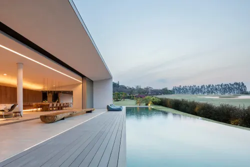 Modern villa with pool overlooking landscape, minimal, photographic, cool