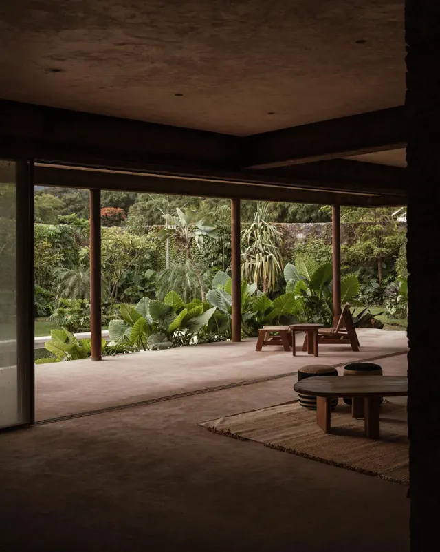 Modern pavilion with lush tropical garden views, minimal, organic, warm