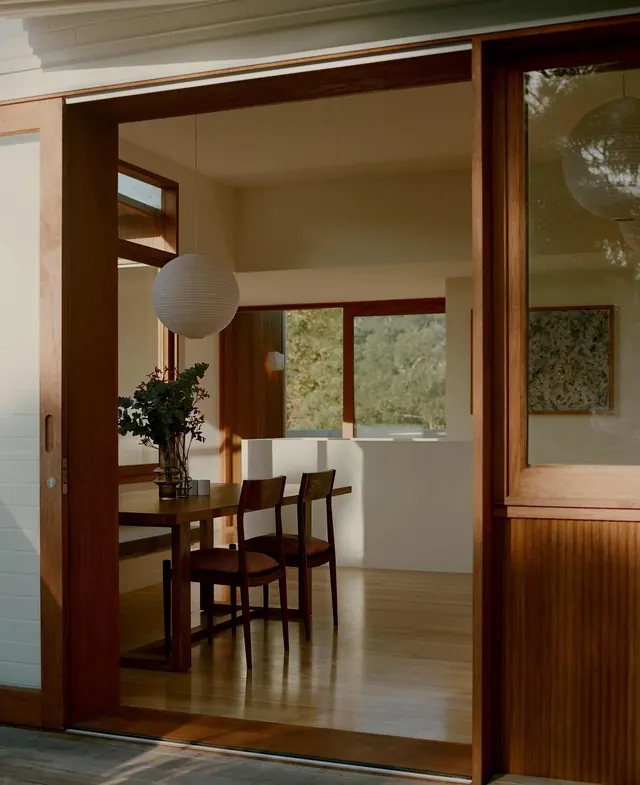 Modern wooden interior with framed views, minimal, organic, warm