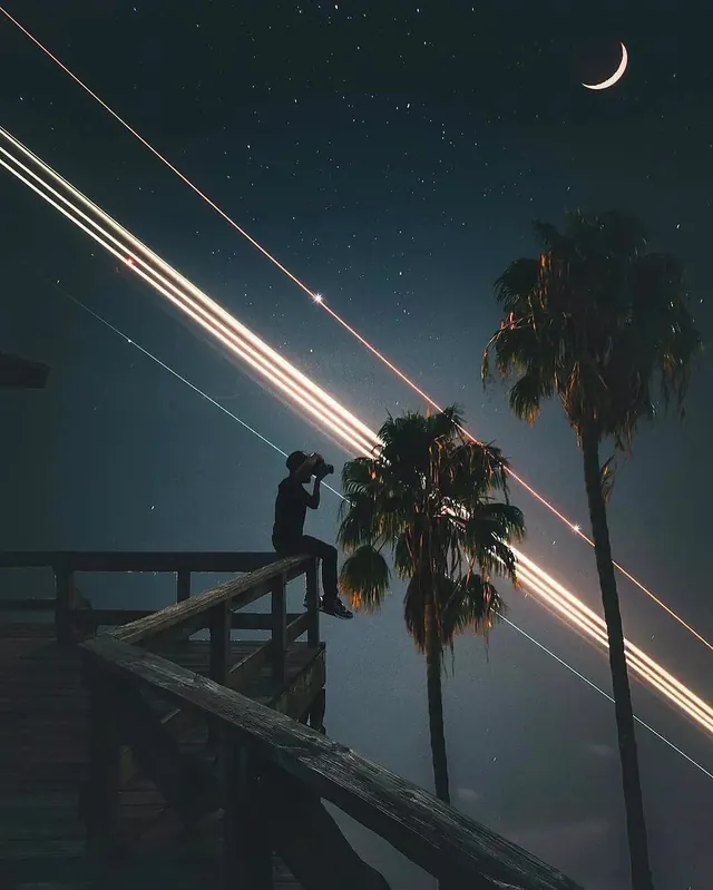 Nighttime silhouette with meteor streaks and moon, photographic, dark-mode, dark