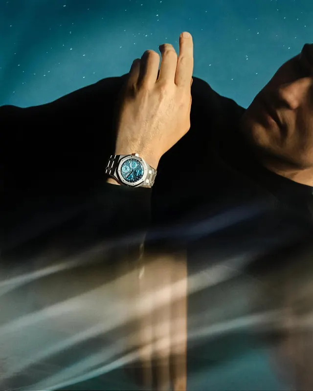 Wrist watch with mountain silhouette and night sky, photographic, minimal, cool