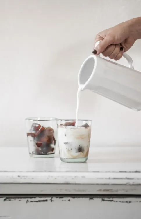 Milk Pouring into Glass