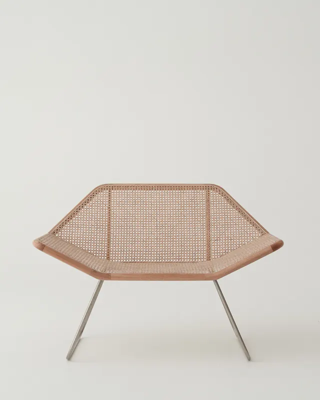 Mid-century lounge chair with woven rattan seat, photographic, minimal, muted