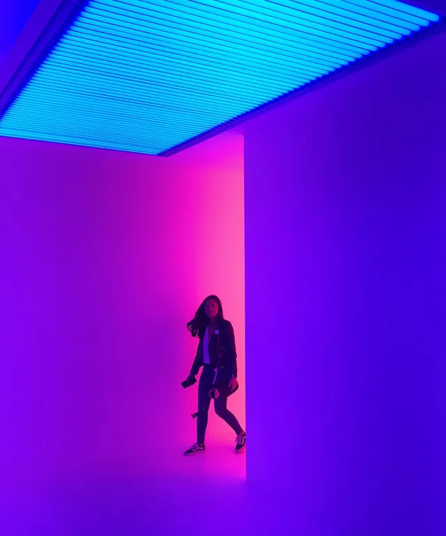 Neon light installation with figure, photographic, gradient-heavy, vibrant