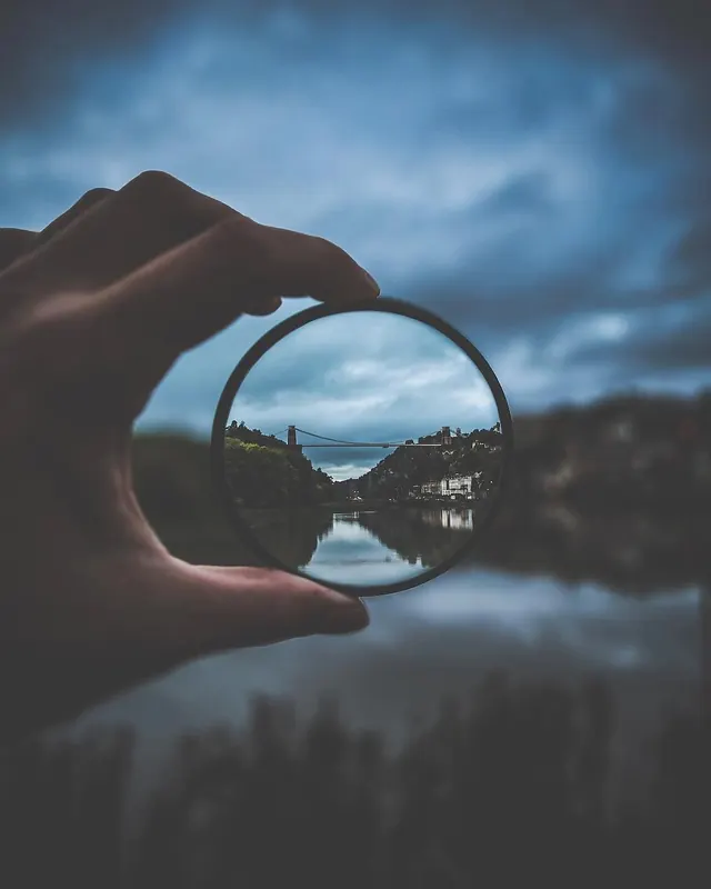 Bridge landscape framed through crystal orb, photographic, organic, cool