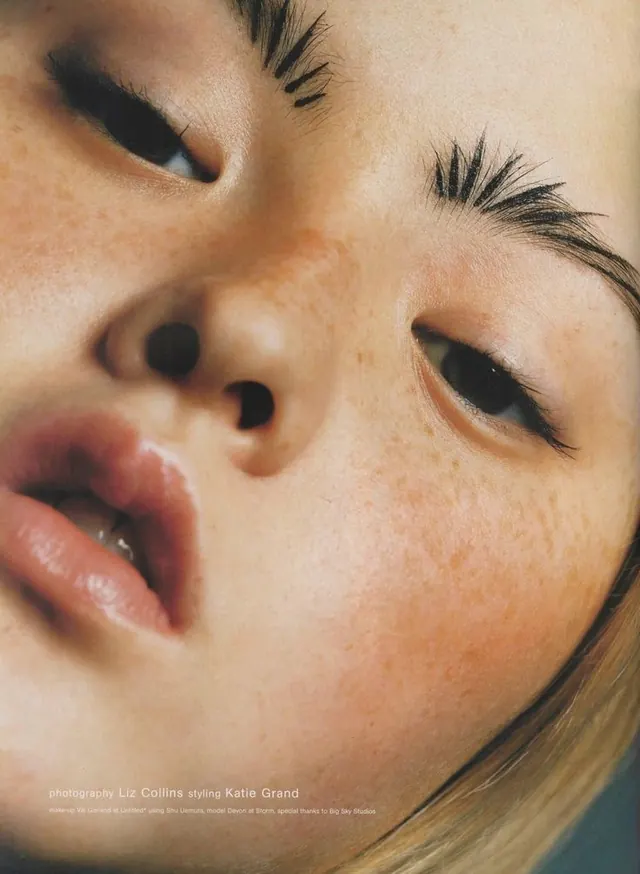 Close-up beauty portrait with golden skin tones, photographic, warm, warm
