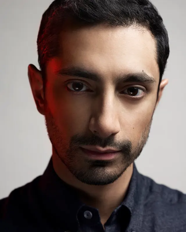 Male portrait with red light overlay, photographic, professional, warm