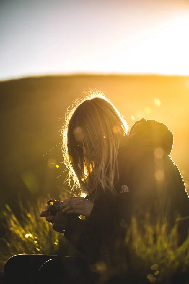 Golden hour portrait with backlighting, photographic, organic, warm