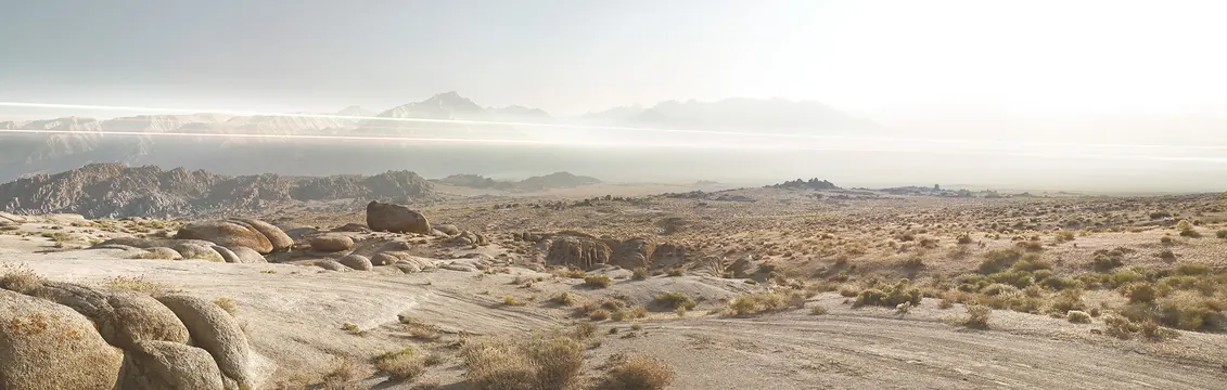 Desert landscape with mountains and haze, photographic, technical, warm