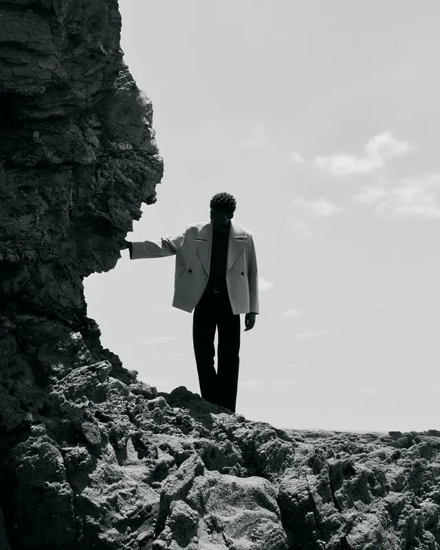 Editorial fashion photography on coastal rocks, editorial, photographic, dark