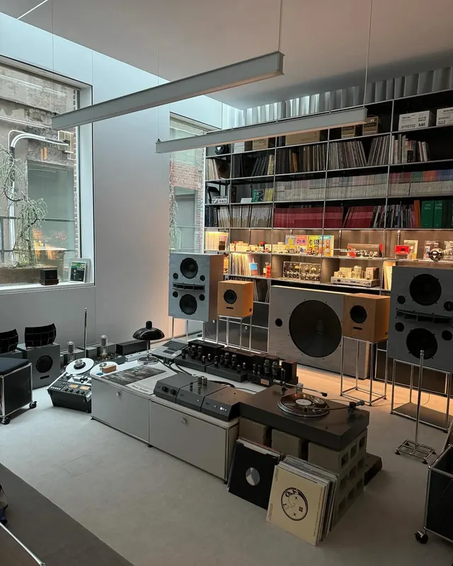 Modular audio and record storage studio setup, technical, minimal, warm
