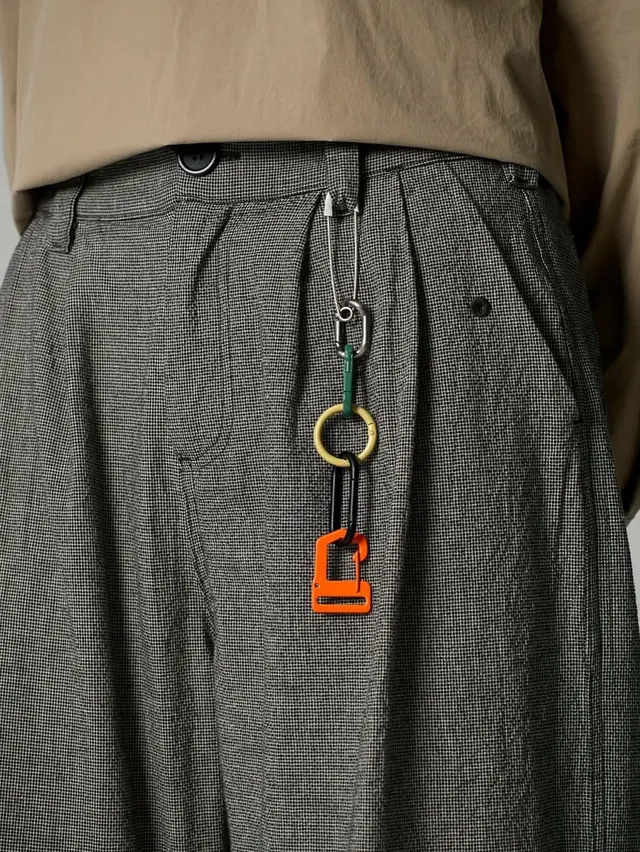 Minimalist fashion detail with colored accents, photographic, minimal, warm