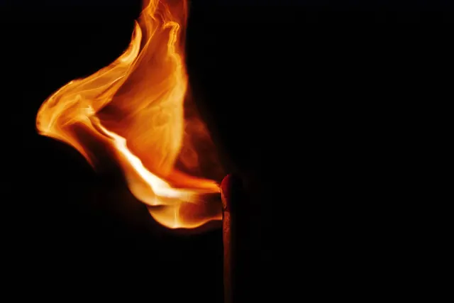 Photograph of flame against black, photographic, organic, vibrant