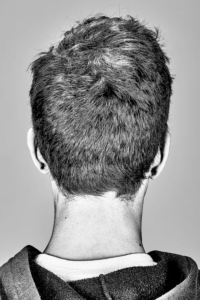 Back of head portrait in black and white, photographic, minimalist, monochrome