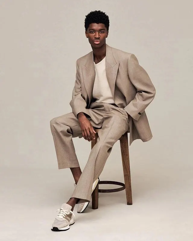 Studio fashion portrait with neutral tones, photographic, minimal, light