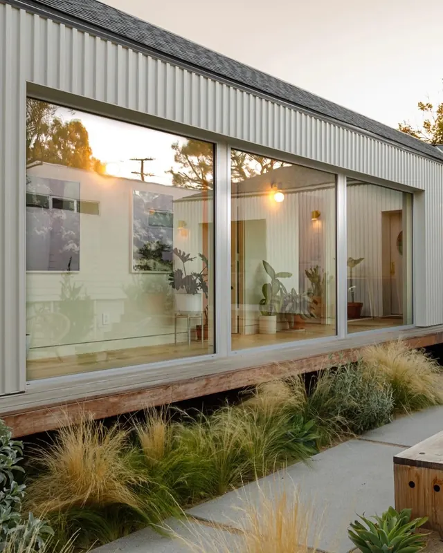 Modern California courtyard with glass facade, architectural, photographic, warm