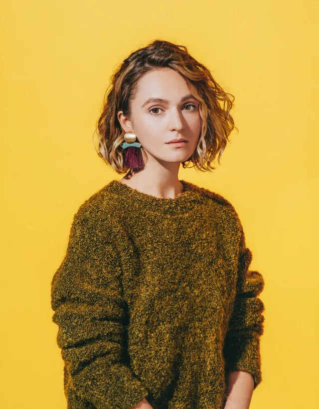 Fashion portrait with bold yellow background, photographic, minimal, vibrant