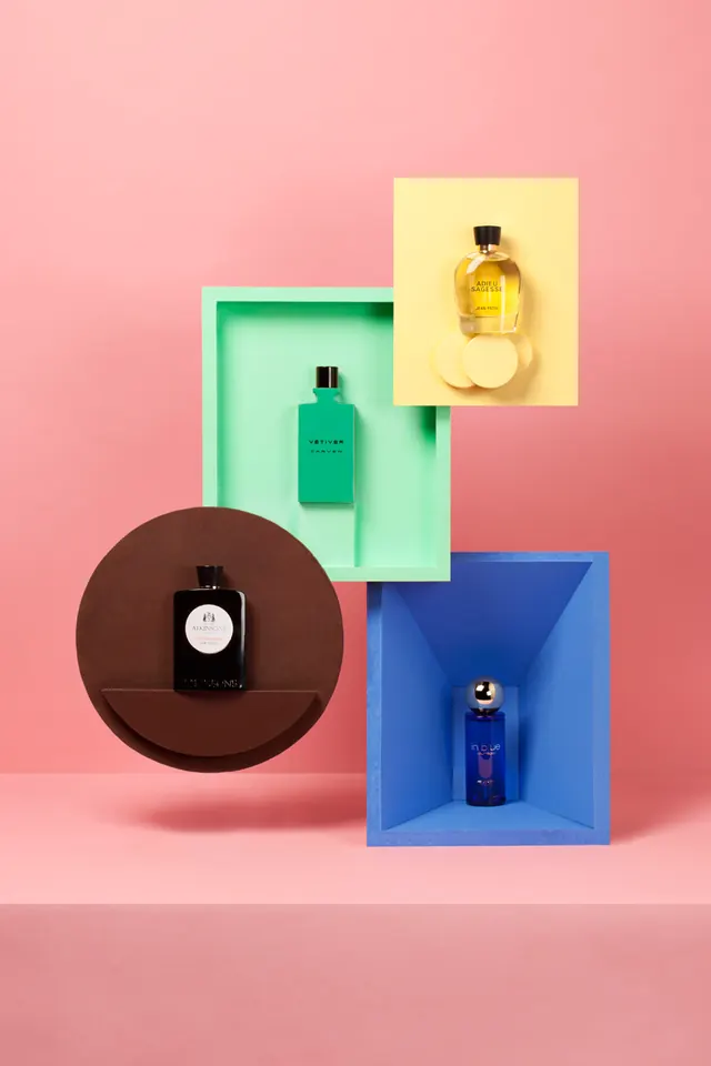 Colorful geometric product display for perfume bottles, photographic, geometric, vibrant