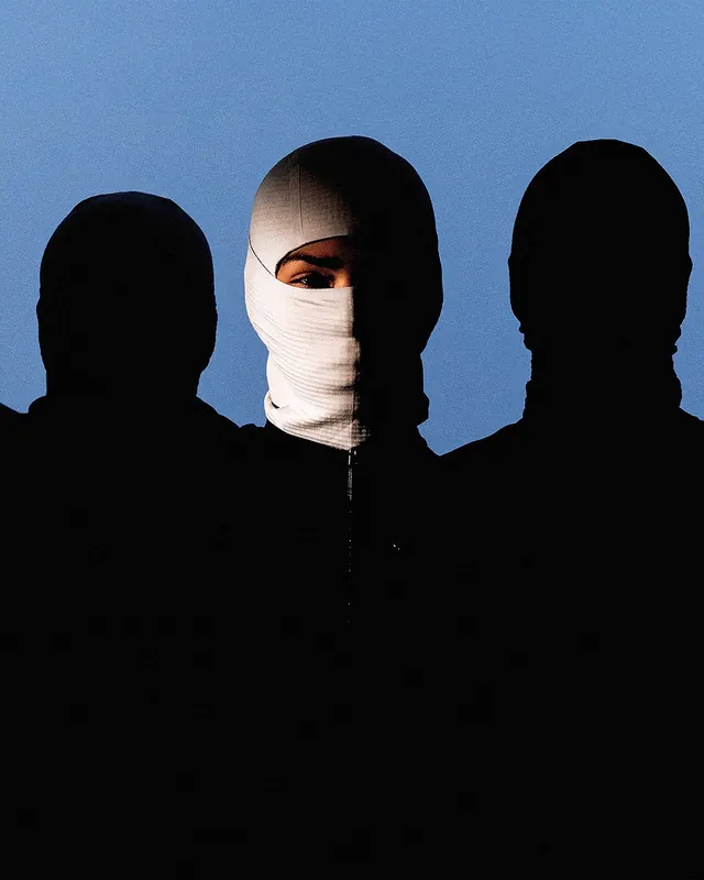 Three silhouettes with center figure wrapped in white cloth, photographic, conceptual, dark