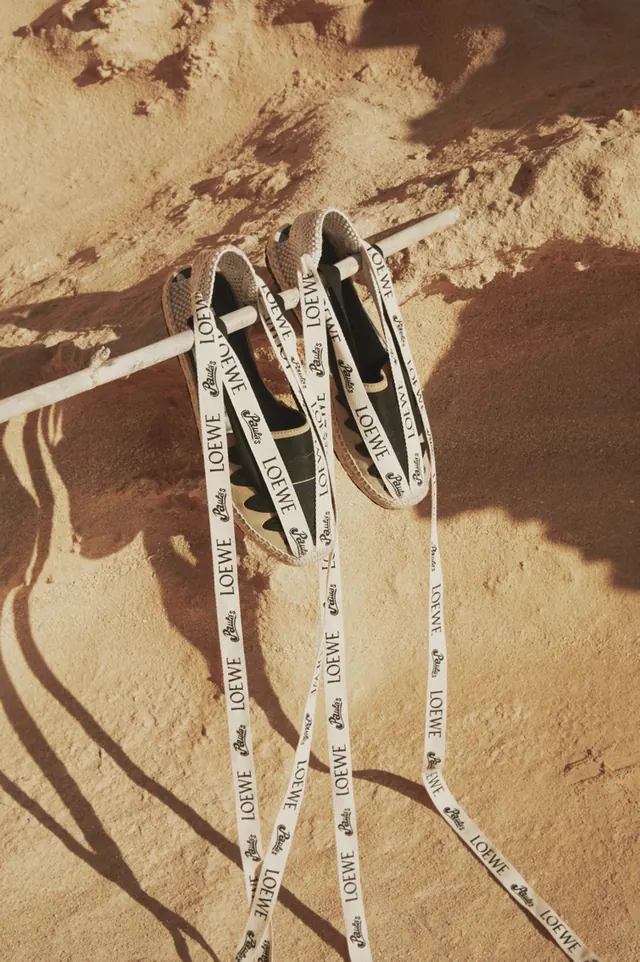 Loewe branded ribbon with shoes, photographic, luxury, earthy