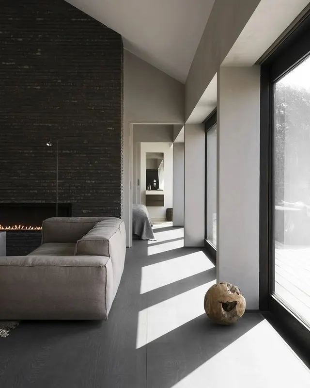 Modern interior with fireplace and seating, photographic, minimalist, dark