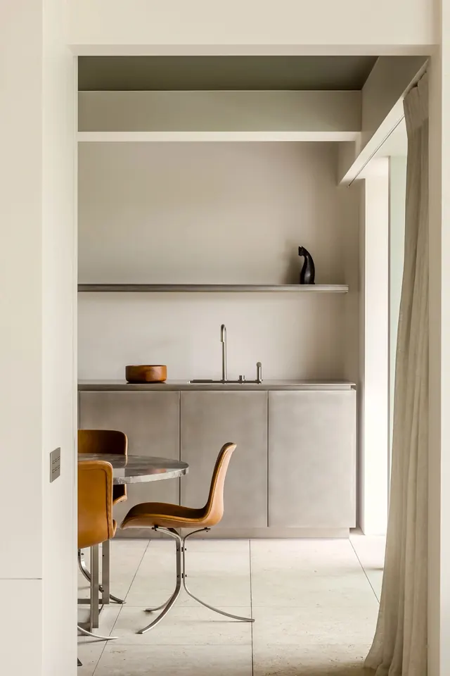 Minimalist office nook with built-in shelving, photographic, minimal, warm