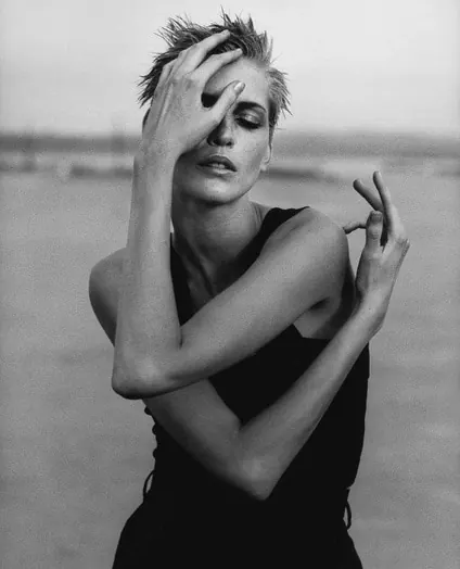Moody contemplative portrait pose, photographic, editorial, monochrome