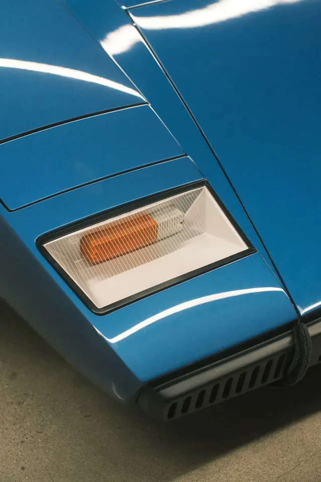 Classic sports car turn signal detail, photographic, cool