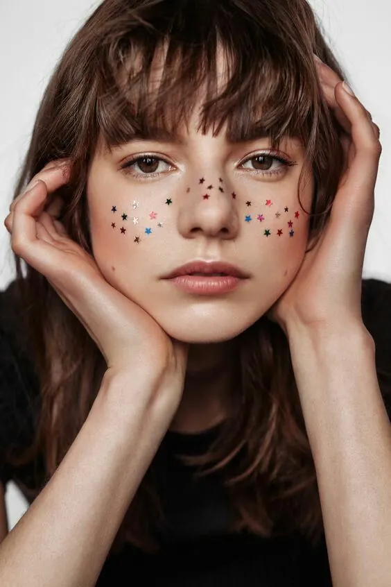 Child portrait with star face art, photographic, playful, warm