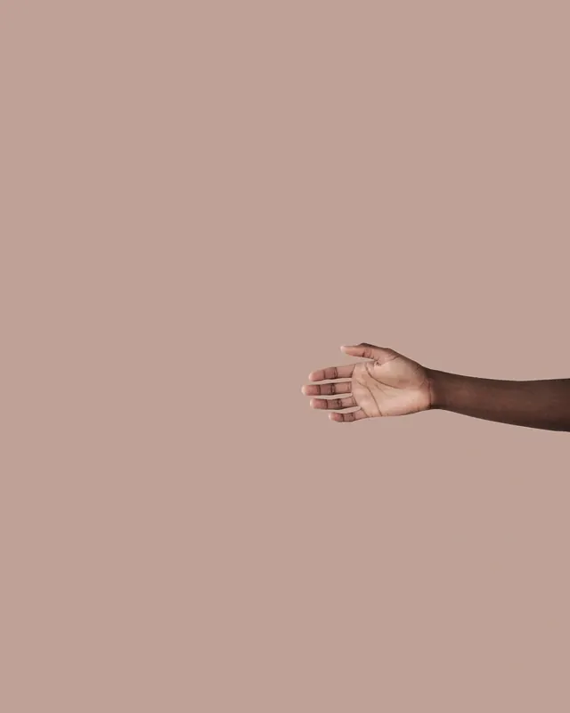 Minimal hand gesture portrait, photographic, minimal, warm