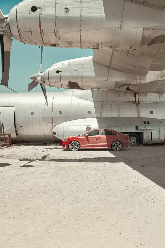 Aircraft and Car in Hangar