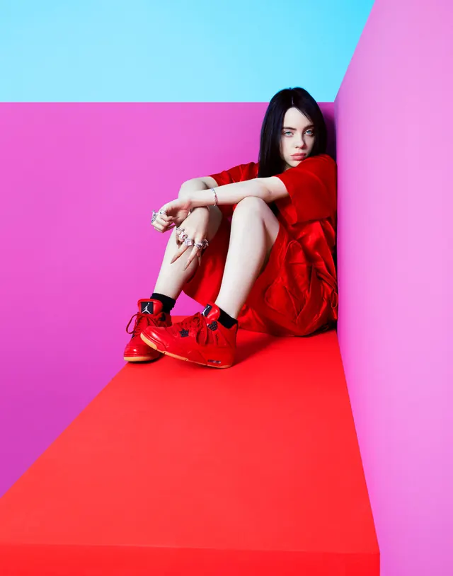 Model in Red Dress on Color Block Background