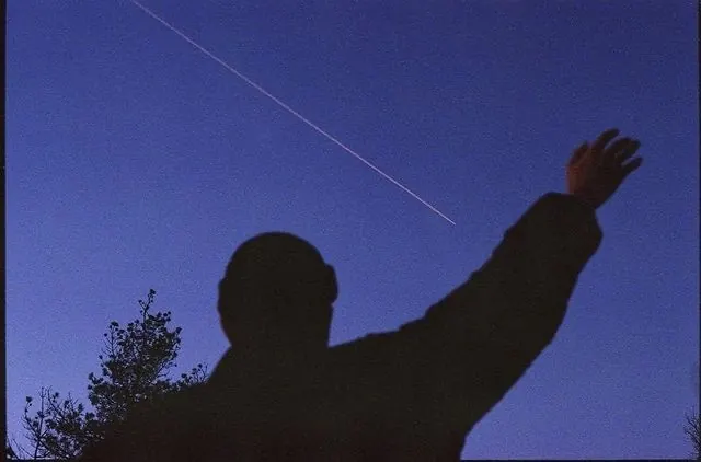 Silhouette reaching for star