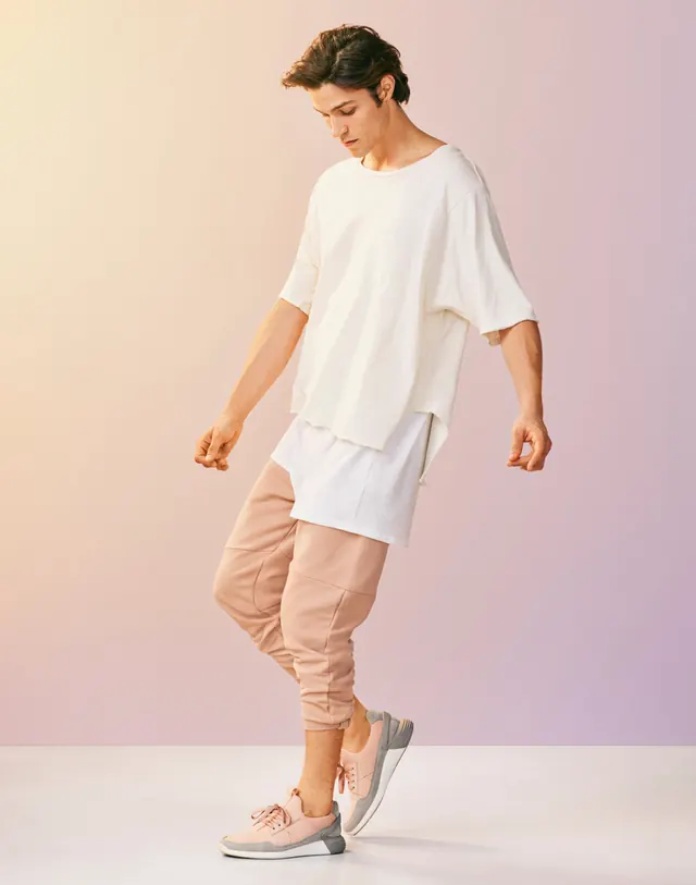 Model in White T-shirt and Pink Trousers