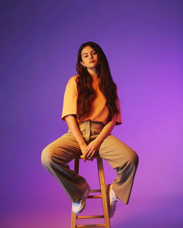Portrait of a woman in a purple studio