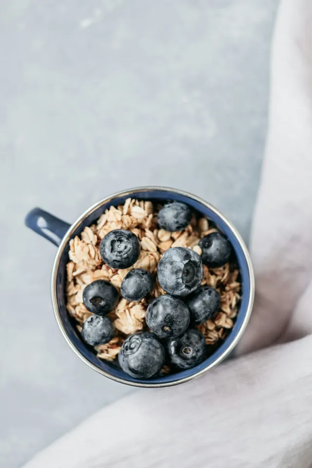 Coffee and Blueberries in a Mug